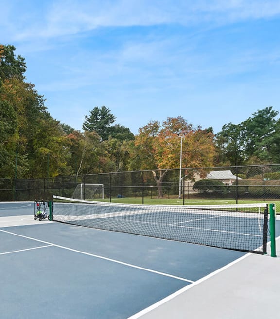 Community Pickleball Courts with Nets at Meadows at Marlborough Apartments located in Marlborough, MA-SMLAM.