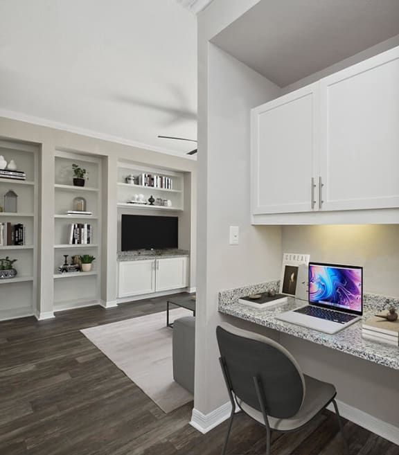 Model Office Area with Wood-Style Flooring and Built in Desk at Chapel Hill Apartments in Lewisville, TX-SMLAM.