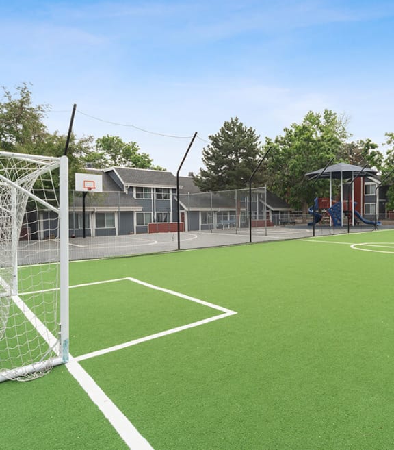 Community Soccer Field with Nets at Bridges at 9 Mile Station Apartments in Denver, CO-SMLAM.