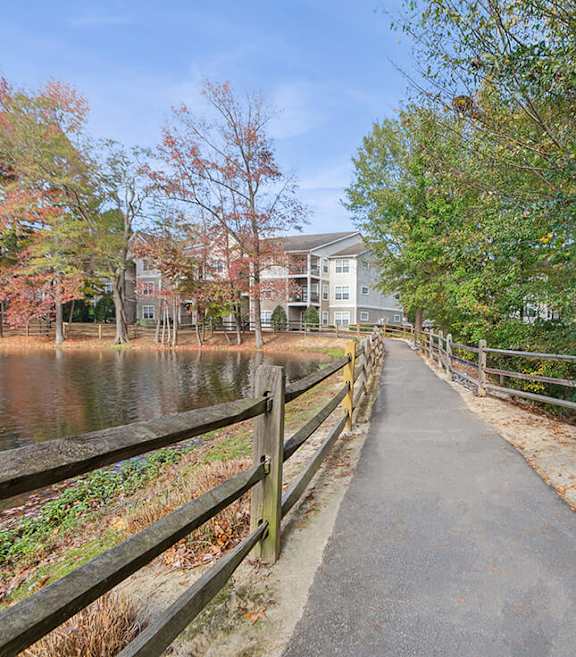 Community Walking Path and Lake at Lake Cameron Apartments located in Apex, NC-SMLAM.