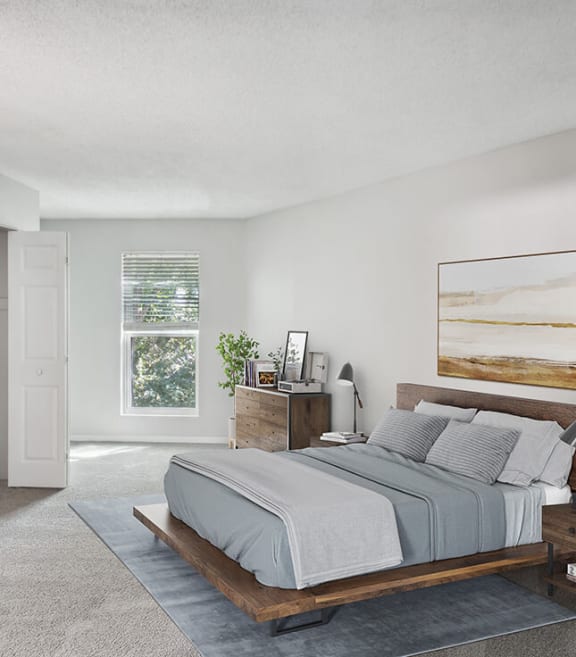 Model Bedroom with Carpet and Window View at Arbor Village Apartments located in Charlotte, NC-SMLAM.
