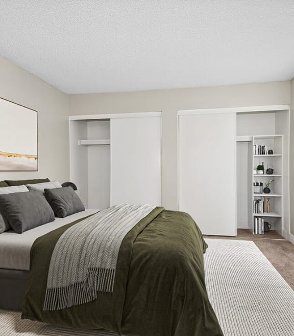 Model Bedroom with Carpet and Double Closets at Villages at Metro Center located in Phoenix, AZ-SMLAM.