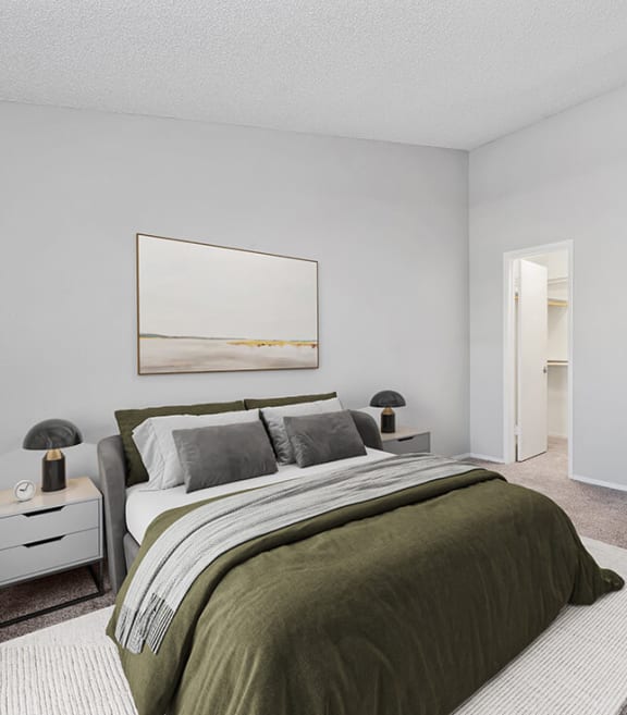 Model Bedroom with Carpet and Walk In Closet at Verona Park Apartments located in Mesa, AZ-SMLAM.