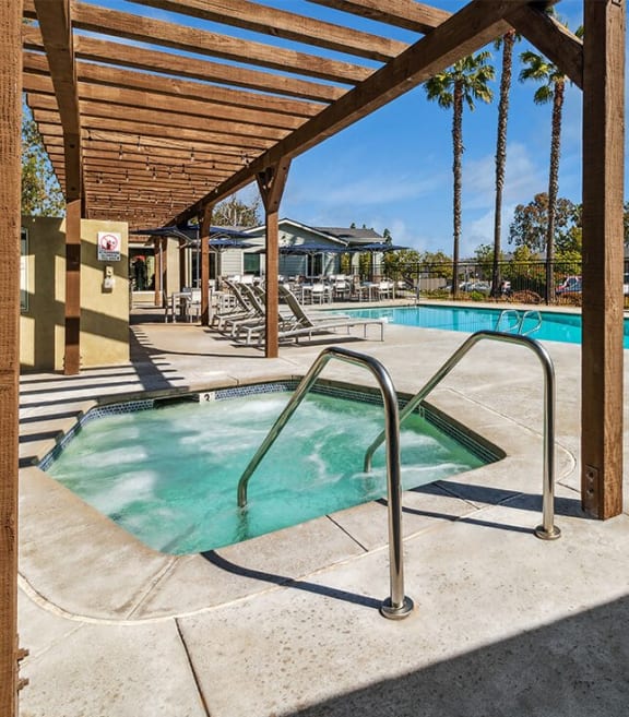 Hot tub under wooden pavilion