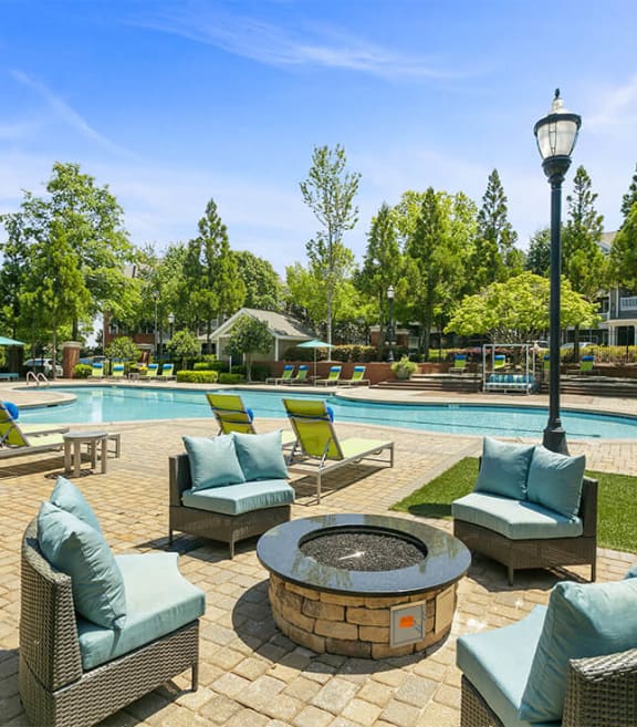 Outdoor firepit and lounge chairs and pool