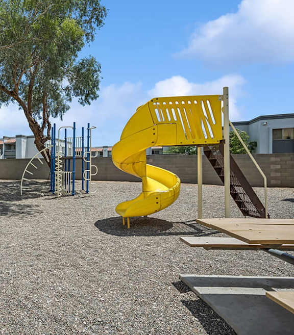 Community Playground and Picnic Tables at Butler Ridge Apartments located in Glendale, AZ-SMLAM.