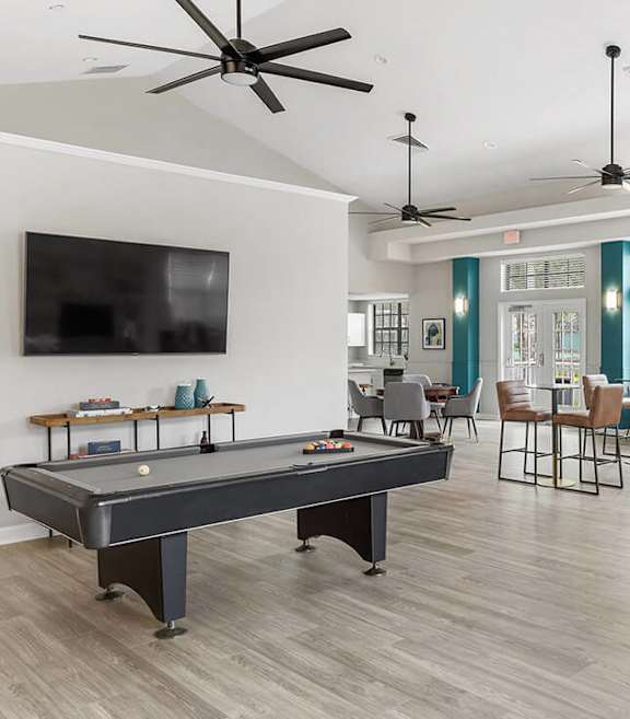 Community Clubhouse with Game Tables at Mirage on Kernan Apartments located in Jacksonville, FL-SMLAM.