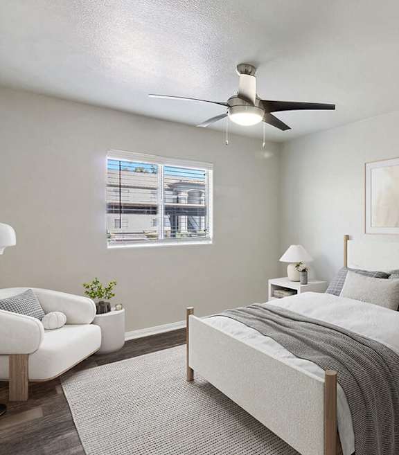 Model Bedroom with Wood-Style Flooring and Window View at Loma Vista Apartments in Las Vegas, NV-SMLAM.