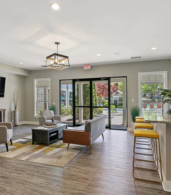 Community Clubhouse with Kitchenette and Lounge Furniture at Parkside at Town Center Apartments in Marietta, GA-SMLAM.