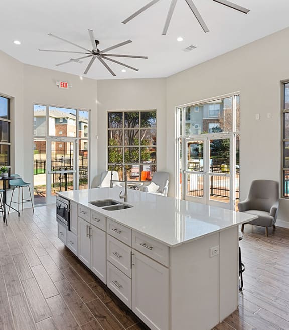 Clubhouse kitchenette at The Belmont at Duck Creek Apartments in Garland, TX.