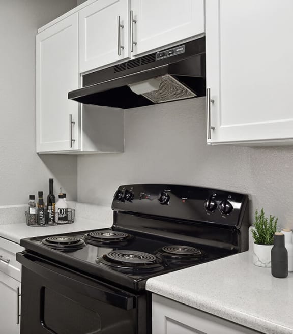 Model Kitchen with White Cabinets at Stonegate Apartments located in Las Vegas, NV-SMLAM.
