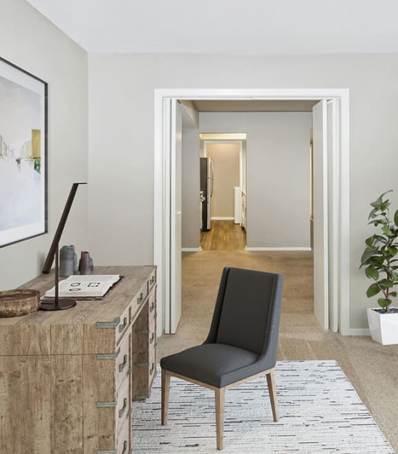 Model Office Area with Carpet at Woodcreek Apartments located in Arlington, TX-SMLAM.