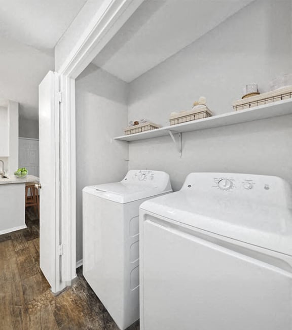 a white laundry room with two washes and a dryer at Heatherstone, Texas, 75287