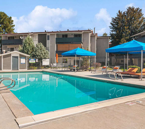 Community Swimming Pool with Pool Furniture at Monaco Apartments in Salt Lake City, UT-SMLAM.