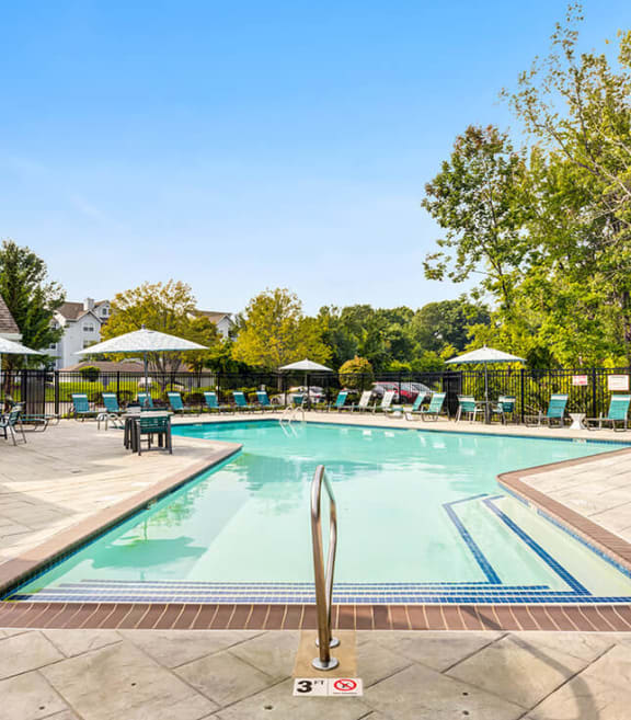 Community Swimming Pool with Pool Furniture at Commons at Haynes Farm Apartments in Shrewsbury, MA-SMLAM.