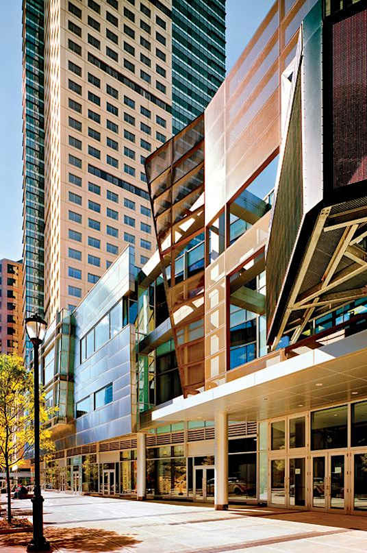 a city street in front of a tall building