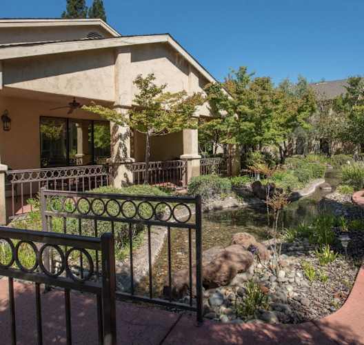 a house with a garden in front of it at Winding Commons Senior Living, Carmichael, CA
