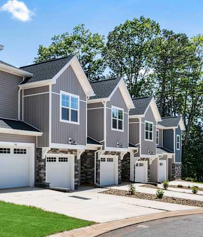 A row of houses with garages are shown in the image.