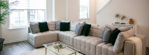 a living room with a couch and a coffee table at Enclave Crystal Lake Townhomes and Apartments, Illinois, 60014
