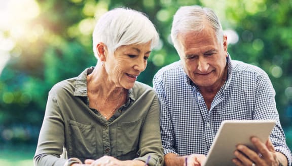 an older man and woman looking at a tablet computer at Loma Linda Springs, Loma Linda, CA, 92354