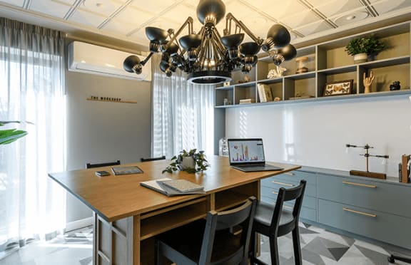 a conference room with a table and chairs and glass walls