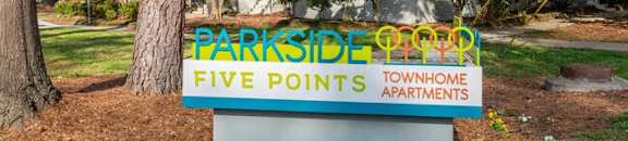 a sign for parkside paradise five points apartments in front of a house at Parkside at Five Points Apartments, Raleigh , NC 27608