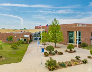 A school building with the sign "Global High" on the front.