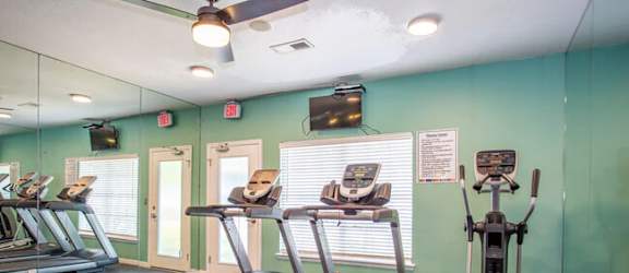 treadmills and other exercise equipment in the fitness room of our apartments