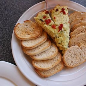 a white plate with a piece of bread on top of it