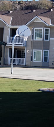 a fitness room with exercise equipment at the whispering winds apartments in pearland, tx