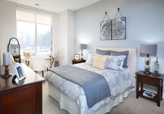 Bedroom with cozy bed at Harrison at Reston Town Center, Reston