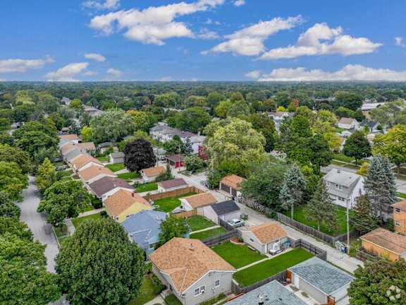 A suburban neighborhood with houses and trees.