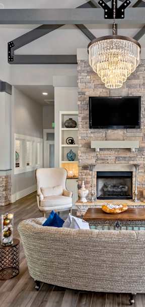 a living room with a large couch and a fireplace
