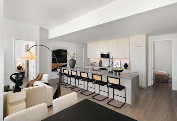 A modern living room with a black coffee table and white furniture. at Olympic + Hill Apartments, Apartments, Los Angeles, CA