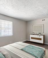 A room with a window covered by white blinds. at Carisma, Dallas, TX, 75240