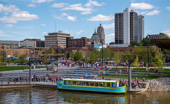 a boat on a river near a crowd of people at The Pearl, Indiana, 46802