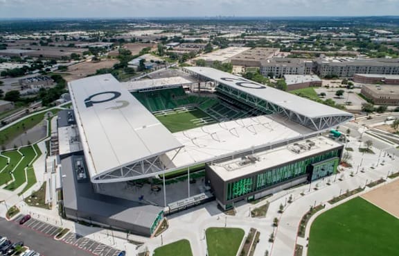 A large stadium with a green  at Brook Meadow Village Apartments , Austin, TX, 78758