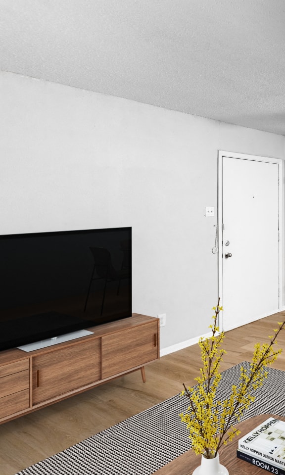 an open living room and dining room with a table and chairs