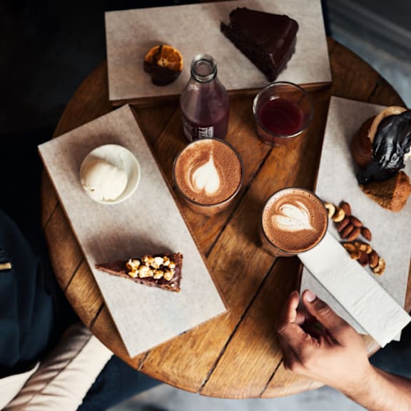 Pastries and Coffee on Small Round Table
