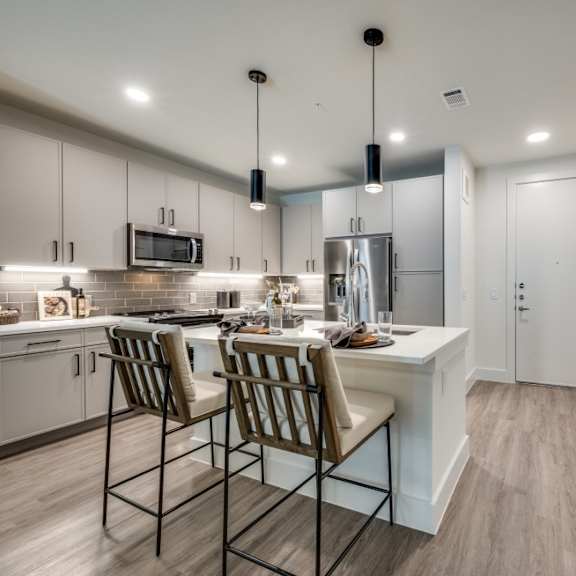 Aura Main Street Apartments in Lewisville, Texas Model Kitchen with Island