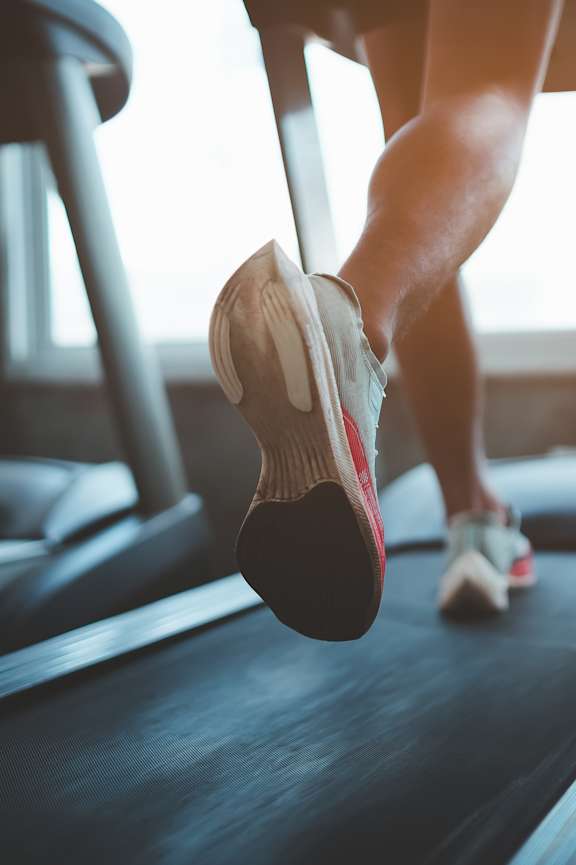 Lifestyle photo of a person running on the treadmill