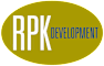 A yellow oval with the letters RPK and the words RPK DEVELOPMENT. at Whispering Fountains Lakewood, Lakewood Bar, CA