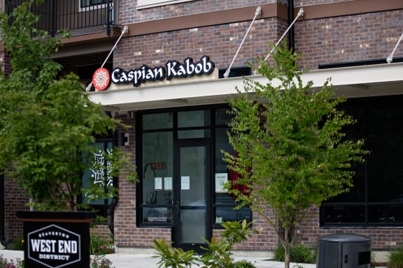 a brick building with a sign that reads cashman radio