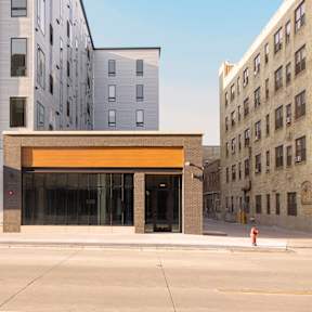 a view of the front of a building on a city street