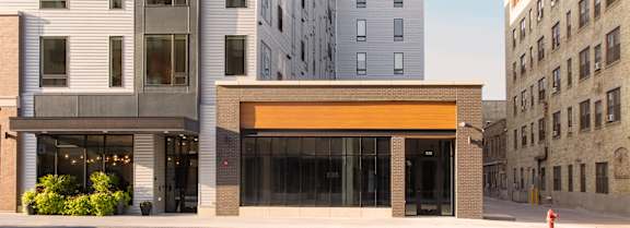 a view of the front of a building on a city street