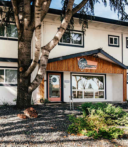a building with a tree in front of it