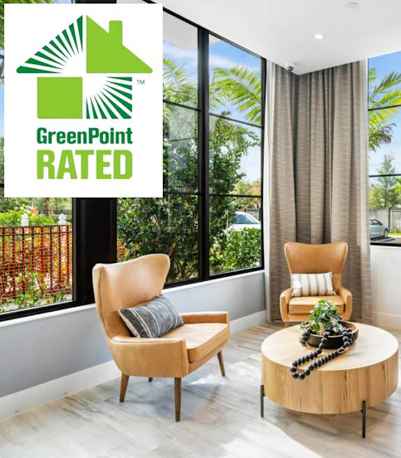 A living room with a GreenPoint Rated sign.