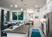 Thumbnail 3 of 19 - a kitchen and dining area in a 555 waverly unit