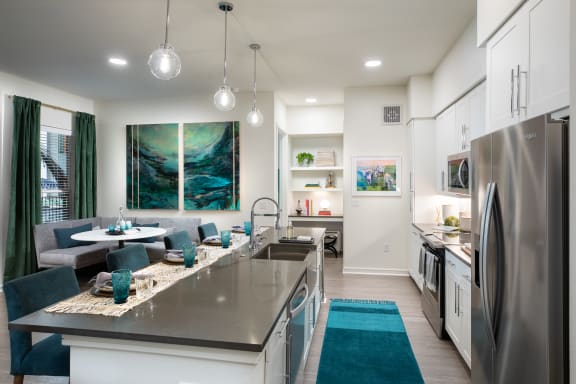 a kitchen and dining area in a 555 waverly unit