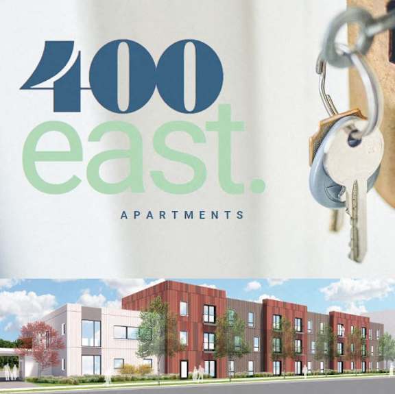 a sign for an apartment building with keys